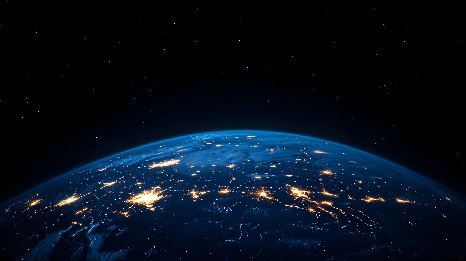 Planeta Terra à noite visto do espaço, com luzes das cidades